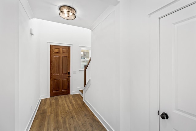 corridor with dark hardwood / wood-style floors