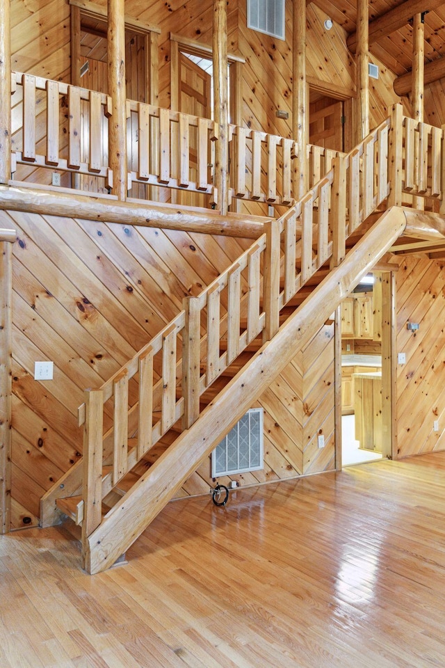 stairs featuring hardwood / wood-style floors