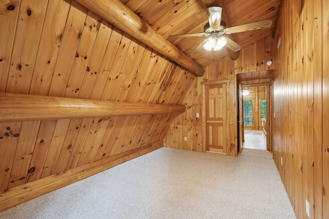 additional living space featuring wood ceiling, carpet flooring, wooden walls, and lofted ceiling with beams