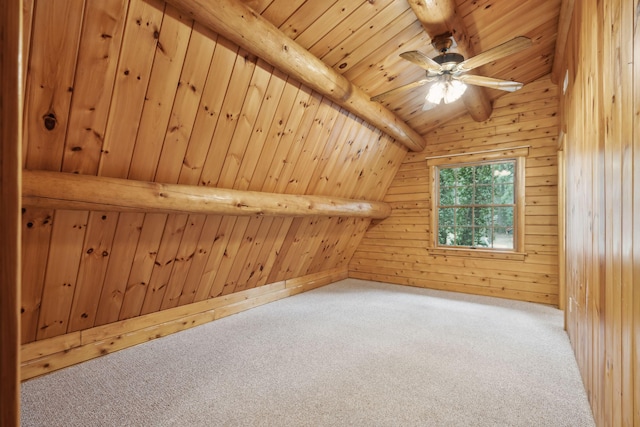 additional living space with carpet flooring, vaulted ceiling with beams, wood ceiling, and wooden walls