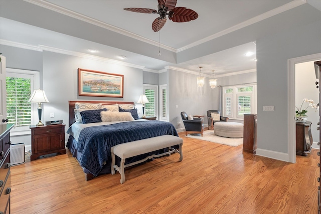 bedroom with light wood-style floors, multiple windows, ornamental molding, a chandelier, and baseboards