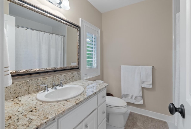 full bath featuring baseboards, toilet, vanity, tile patterned flooring, and a shower with shower curtain