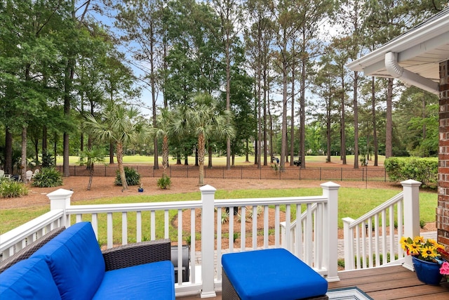 wooden deck featuring view of scattered trees