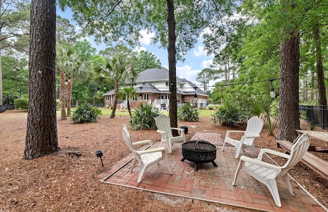 view of patio / terrace featuring an outdoor fire pit
