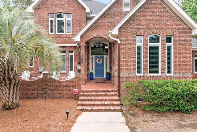 view of front of property featuring brick siding