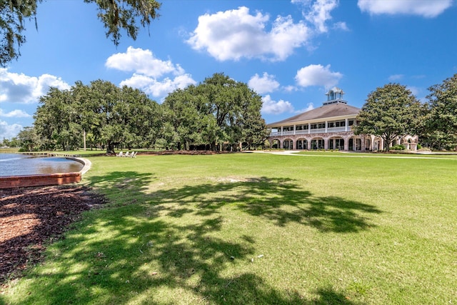 view of grassy yard with a water view