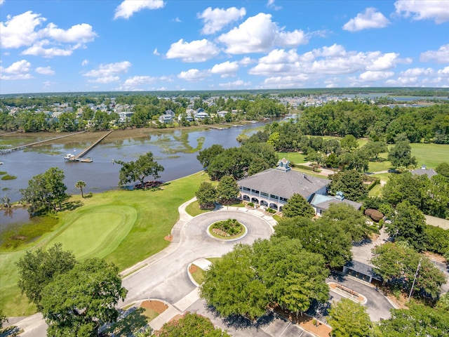 aerial view of a nearby body of water, a tree filled landscape, and a local golf course