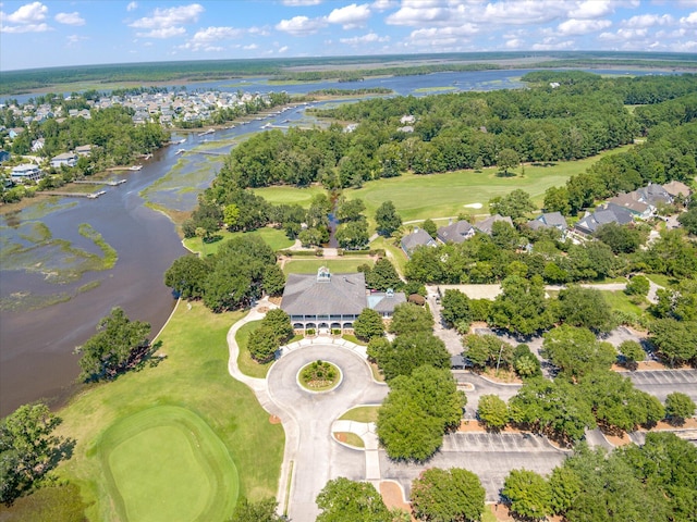 aerial view of property and surrounding area featuring a large body of water, a golf club, and nearby suburban area