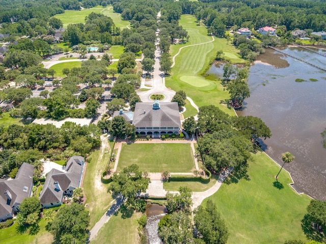 aerial overview of property's location with a nearby body of water and nearby suburban area