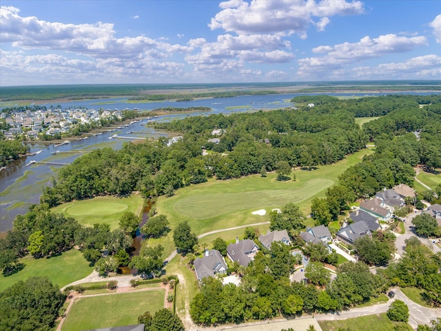 aerial view of residential area featuring a large body of water and a local golf course