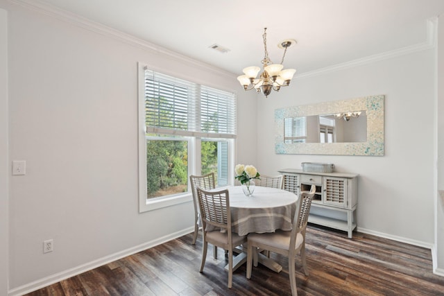 dining area with crown molding, a chandelier, and dark hardwood / wood-style floors