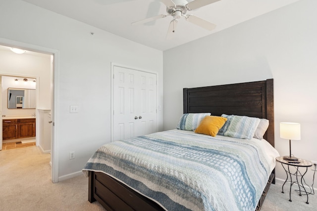 carpeted bedroom featuring ceiling fan, connected bathroom, and a closet