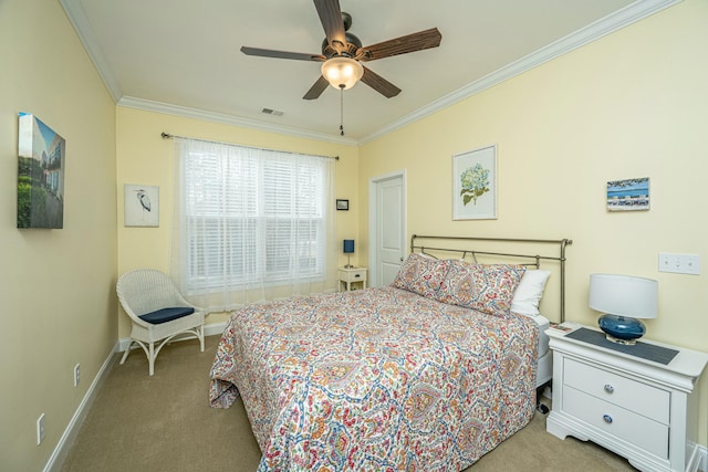 bedroom featuring crown molding, light colored carpet, and ceiling fan