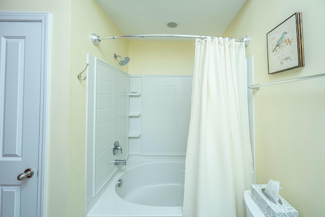 bathroom with toilet and shower / bathtub combination with curtain