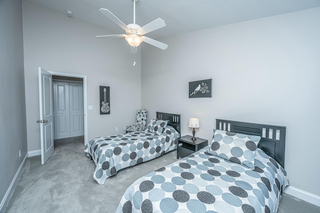 bedroom with light carpet, high vaulted ceiling, and ceiling fan