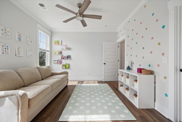 living area featuring visible vents, dark wood-type flooring, baseboards, ornamental molding, and a ceiling fan