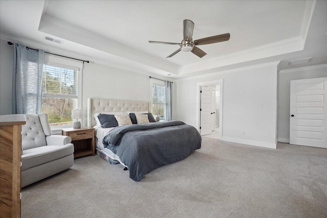 bedroom with visible vents, a raised ceiling, carpet, and ornamental molding