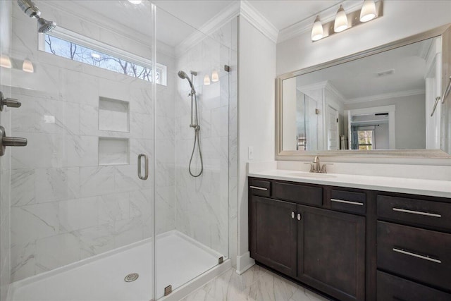 bathroom with vanity, marble finish floor, ornamental molding, and a shower stall