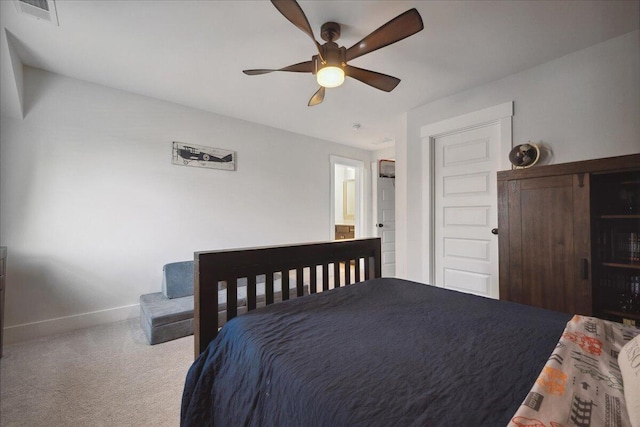 bedroom with carpet flooring, visible vents, baseboards, and ceiling fan