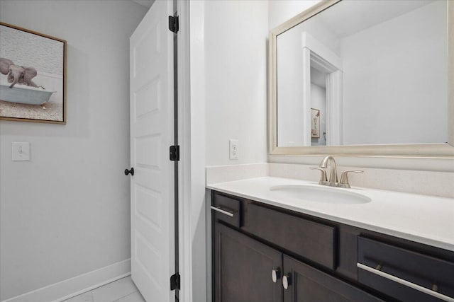 bathroom featuring vanity and baseboards