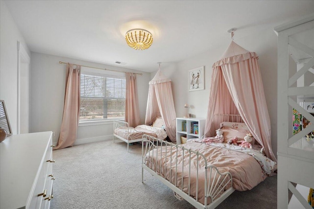 bedroom featuring baseboards, visible vents, and carpet floors