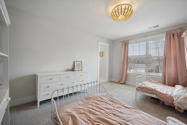 bedroom featuring carpet, visible vents, and baseboards