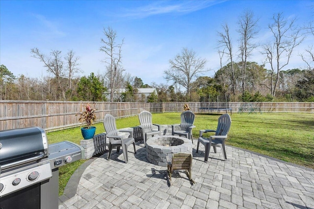 view of patio / terrace featuring a fire pit and a fenced backyard