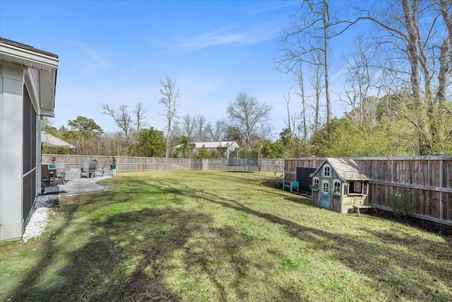 view of yard featuring a patio area and a fenced backyard