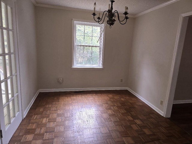 2858 Riley St, Orangeburg, SC 29118 - unfurnished dining area with a textured ceiling, ornamental molding, baseboards, and an inviting chandelier
