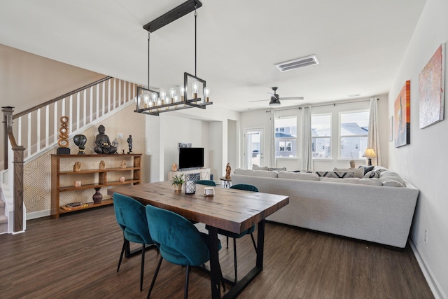 dining space featuring dark hardwood / wood-style flooring and ceiling fan