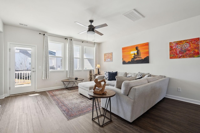 living room with dark hardwood / wood-style floors and ceiling fan