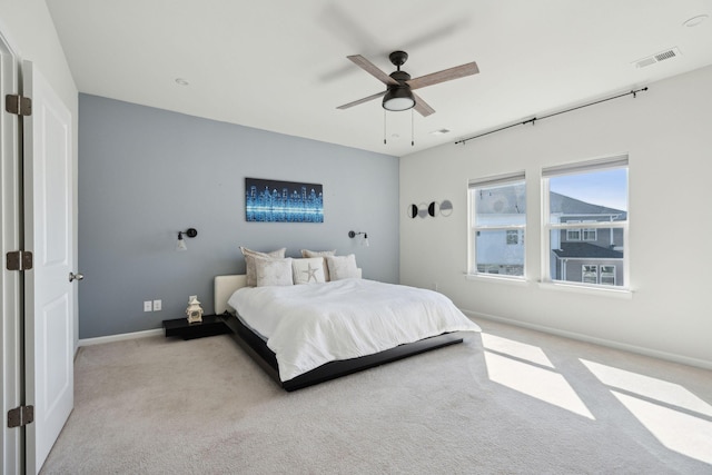 carpeted bedroom with ceiling fan