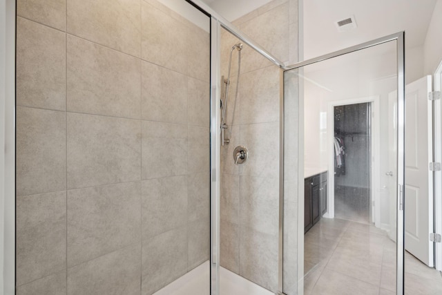 bathroom with walk in shower and vanity