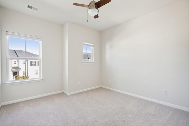 carpeted empty room with ceiling fan