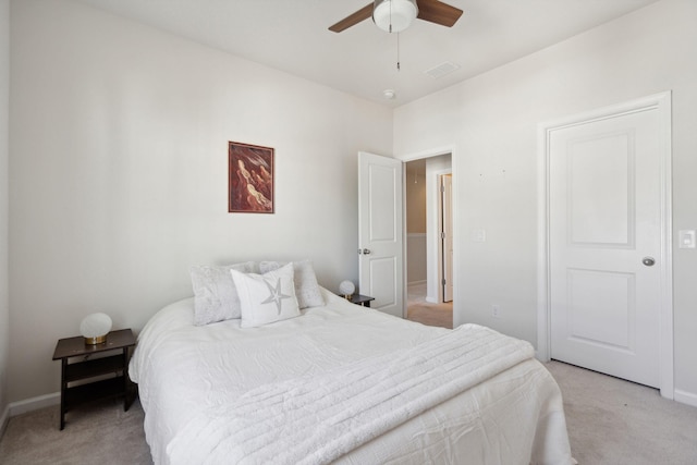 bedroom featuring light colored carpet and ceiling fan