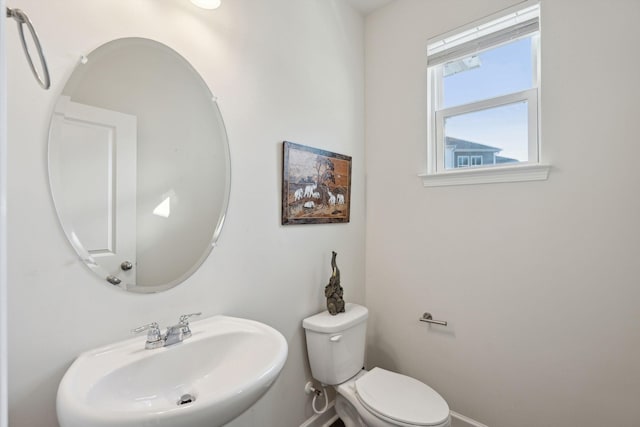 bathroom featuring toilet and sink