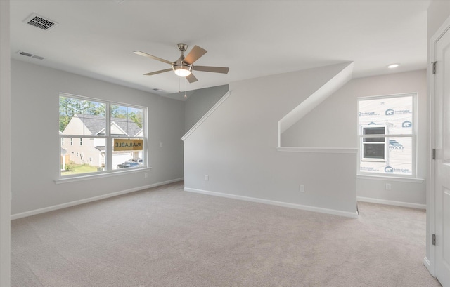 additional living space featuring a wealth of natural light, visible vents, and baseboards