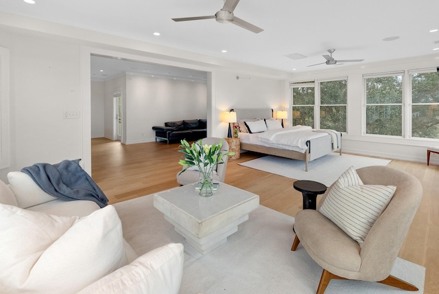 bedroom with ceiling fan, baseboards, wood finished floors, and recessed lighting