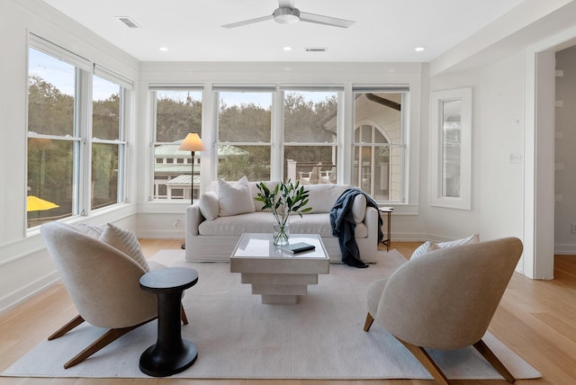 sunroom with visible vents and a ceiling fan