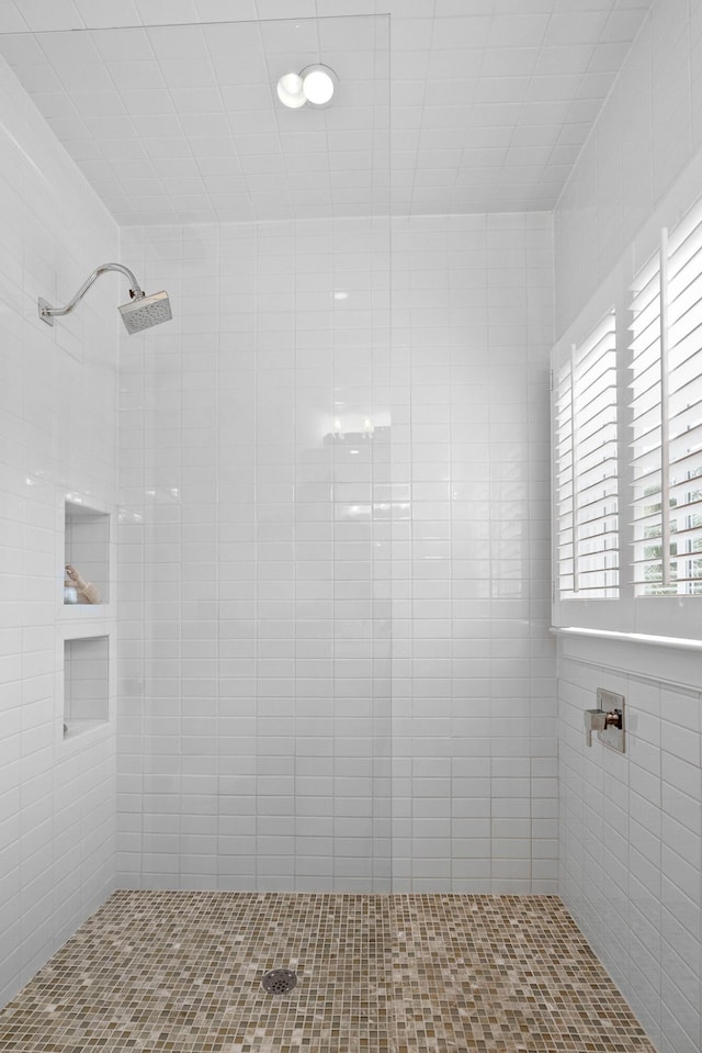 bathroom with tiled shower