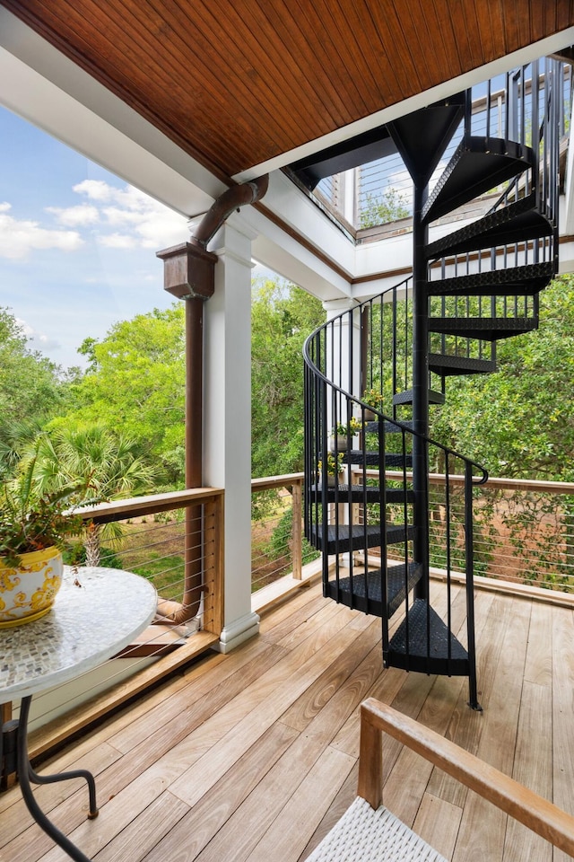 wooden terrace featuring stairs