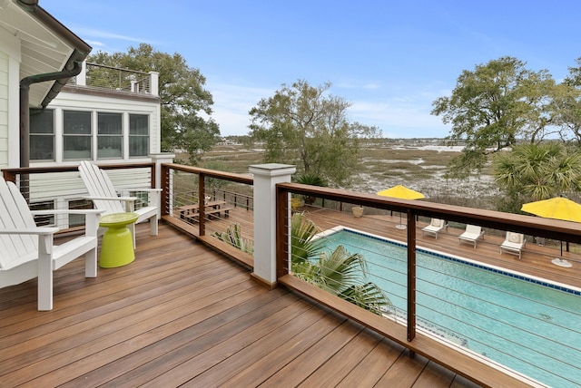 wooden deck with an outdoor pool