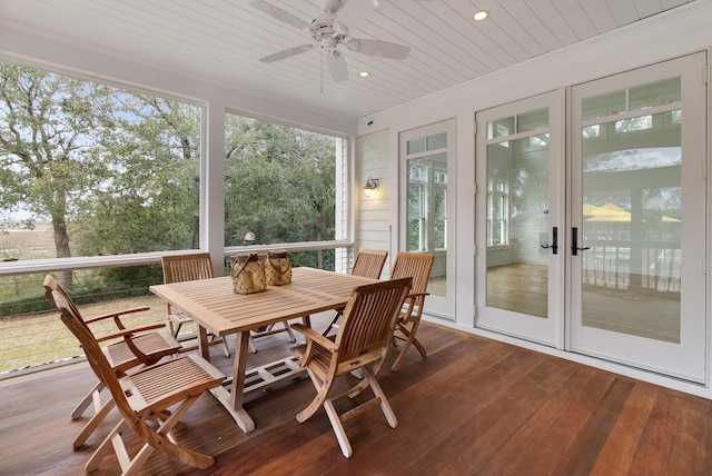 sunroom with wooden ceiling and ceiling fan