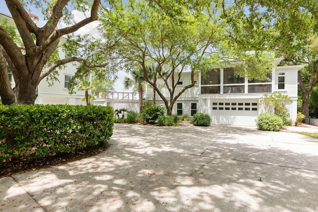 view of front of house featuring concrete driveway and an attached garage