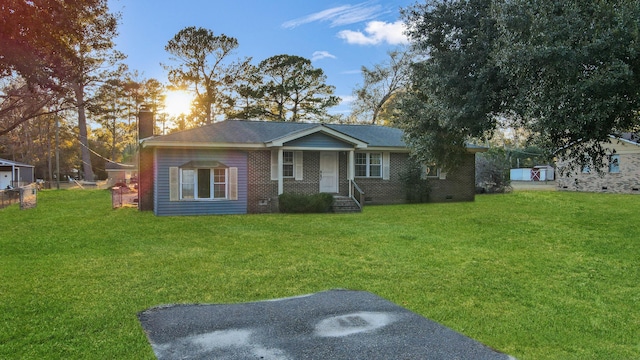 view of front of property with a lawn