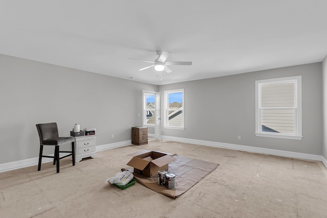 interior space with ceiling fan