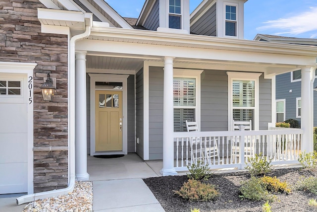 doorway to property with a porch