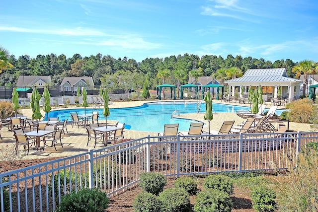 view of swimming pool featuring a gazebo and a patio