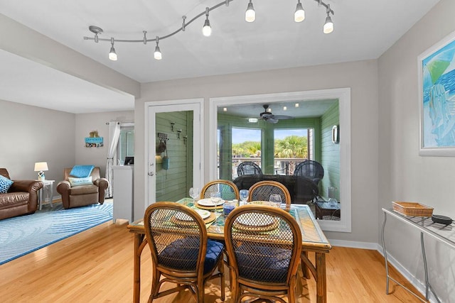1627 Live Oak Park, Seabrook Island, SC 29455 - dining space featuring light wood finished floors, a ceiling fan, track lighting, and baseboards