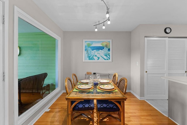 1627 Live Oak Park, Seabrook Island, SC 29455 - dining space featuring baseboards, light wood-style floors, and track lighting